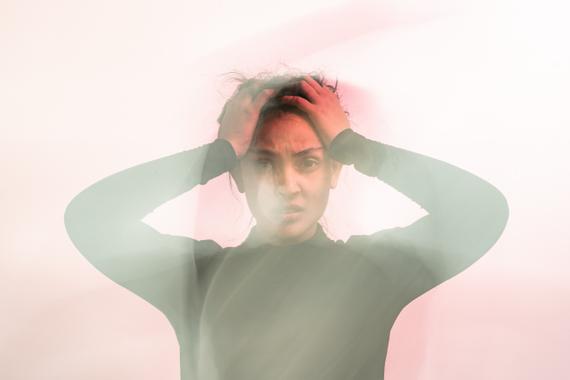 Holding head in confusion and frustration